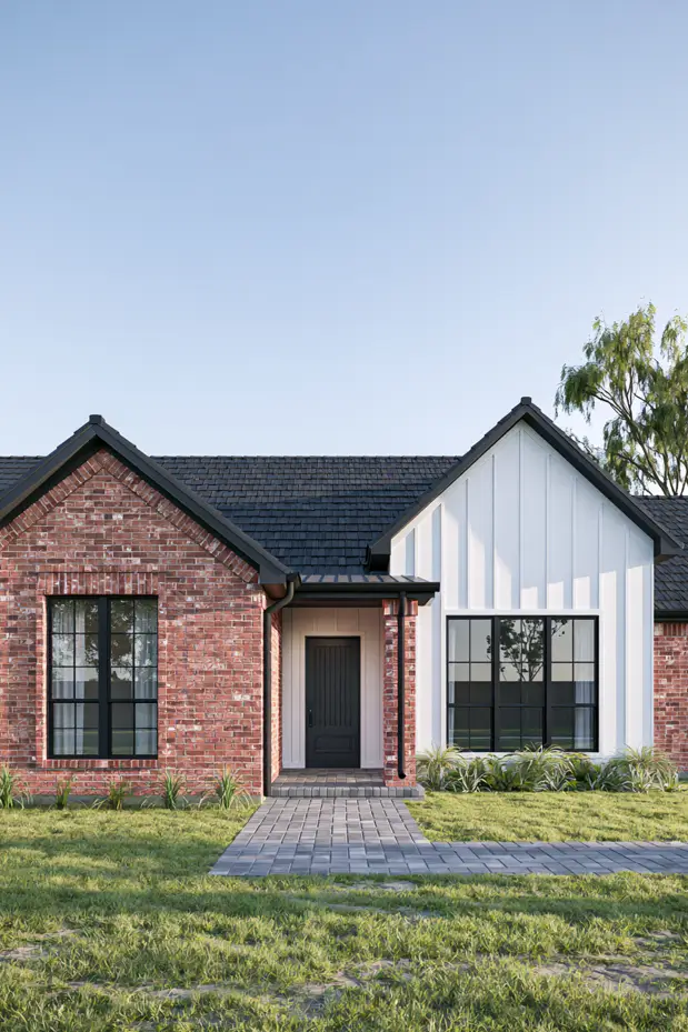 Single-story ranch with a two-tone facade — red brick on one wing, white board-and-batten on the other, black tile roof