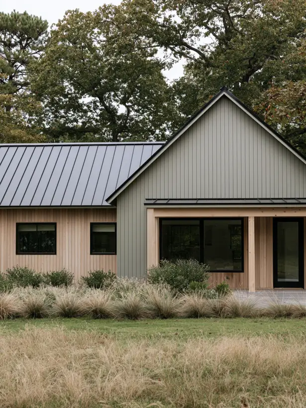 Olive sage green board-and-batten house exterior with charcoal standing-seam metal roof